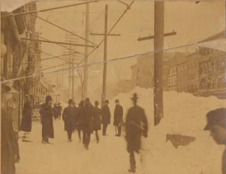 Snow Scene, pedestrians on a city street.