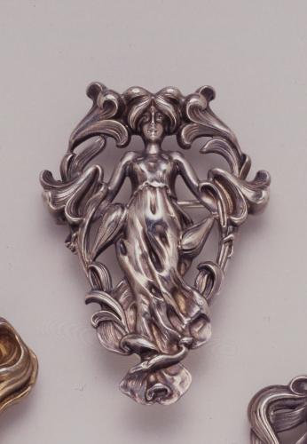 Brooch in the form of a woman with lilies