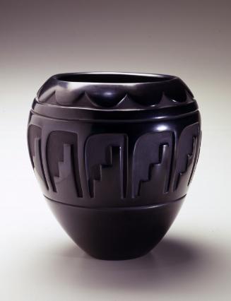 Black jar with carved decoration