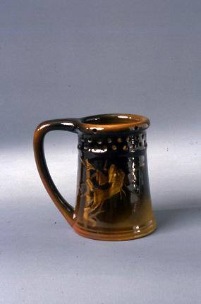 Puzzle mug with decoration of a goblin