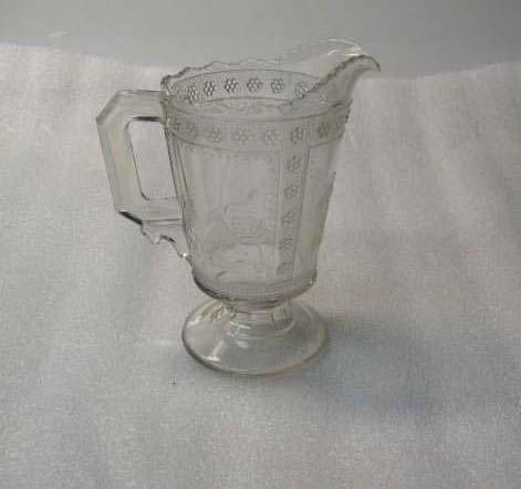 Cream pitcher with foot, Egyptian pattern